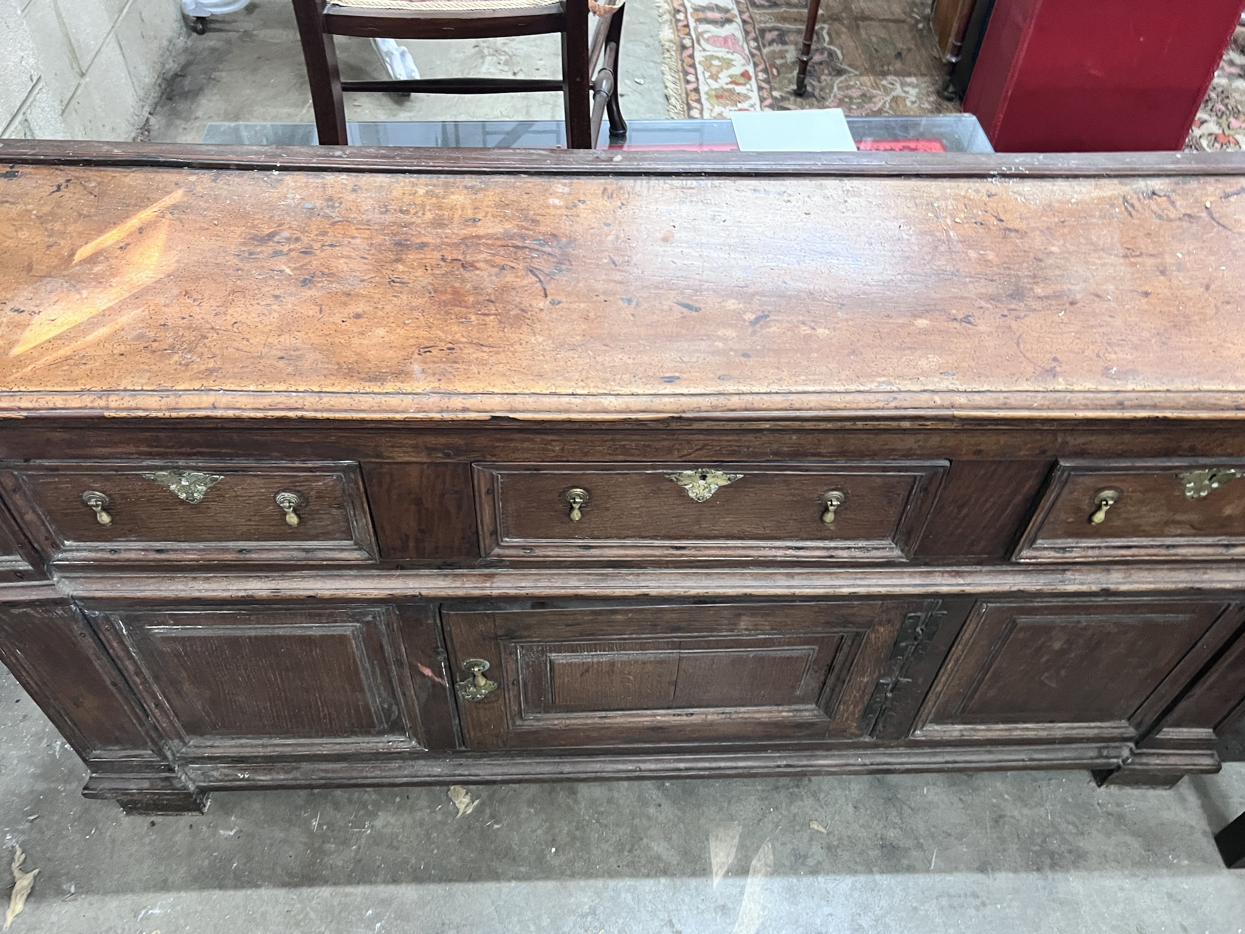 An 18th century oak and fruitwood low dresser, length 160cm, depth 40cm, height 86cm